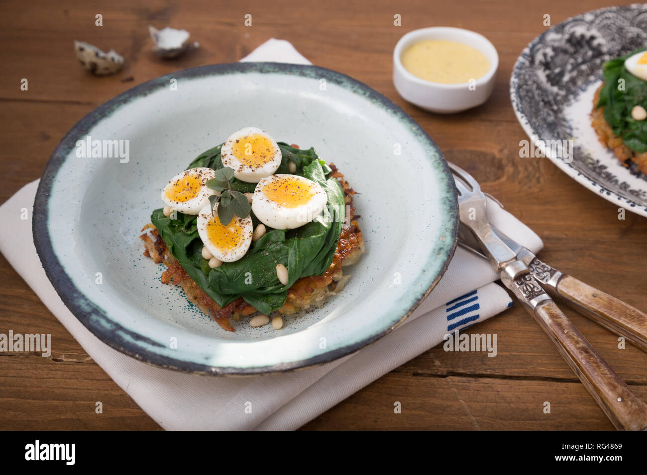 Quail Eggs florentine with spinach and rosti Stock Photo Alamy