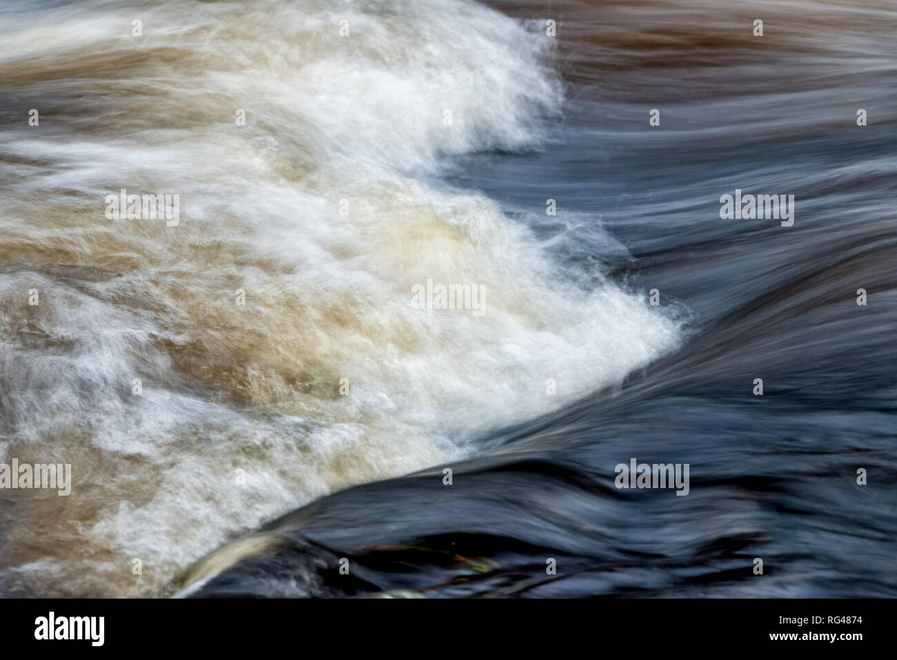 fast flowing water in mountain river in sweden Stock Photo