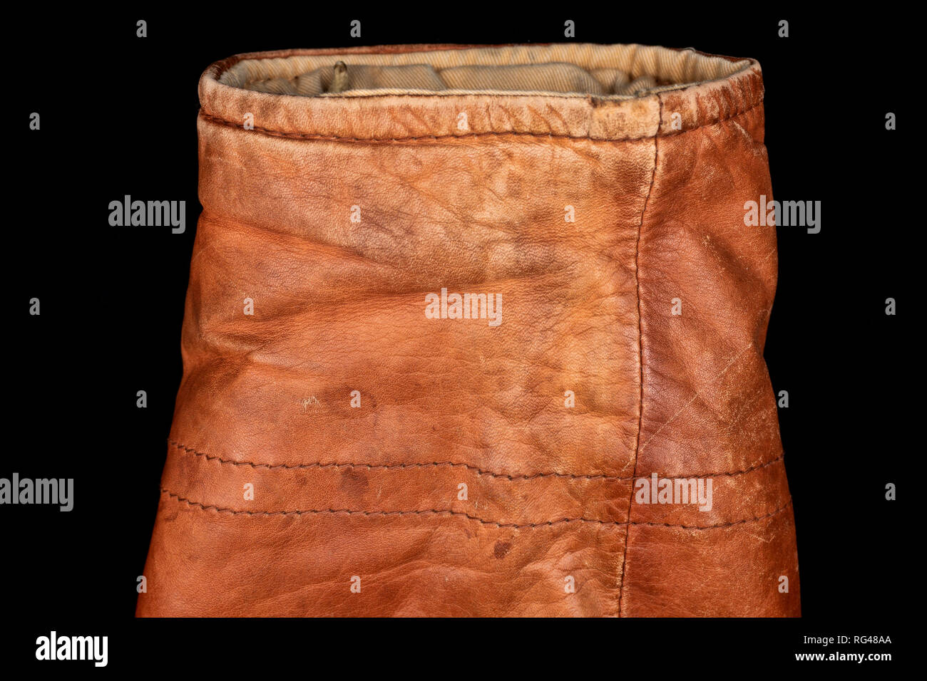 sleeve of brown worn aviator leather jacket Stock Photo