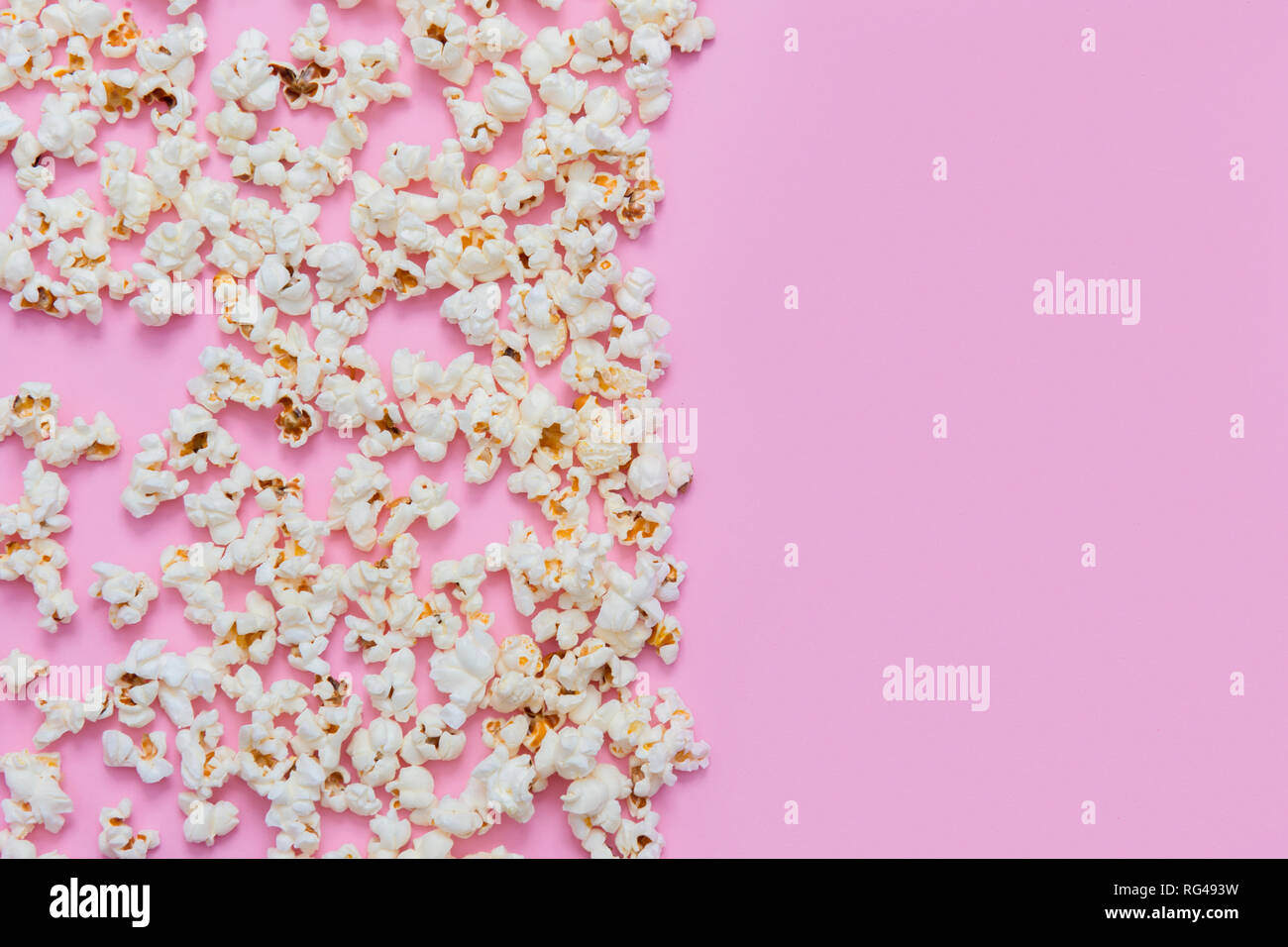 Popcorn pattern on pink background. Top view Stock Photo