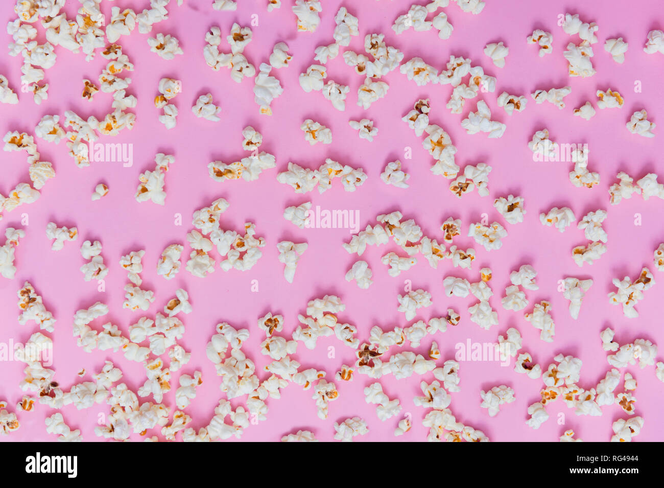 Popcorn pattern on pink background. Top view Stock Photo