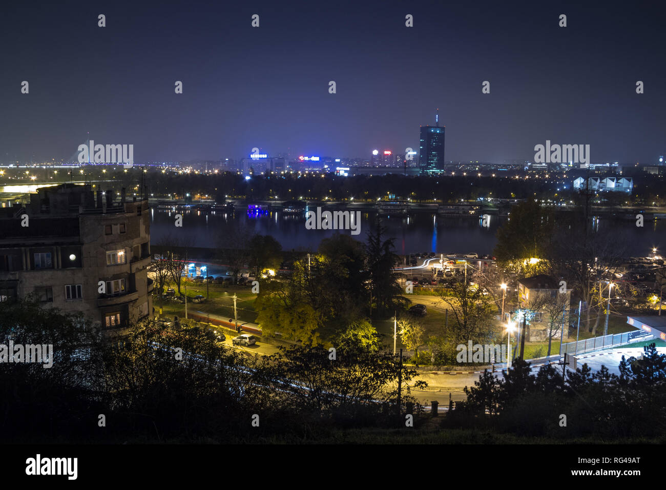 BELGRADE, SERBIA - NOVEMBER 8, 2014: Skyline of New Belgrade (Novi Beograd) seen by night from the Kalemegdan fortress. The main landmarks of the dist Stock Photo