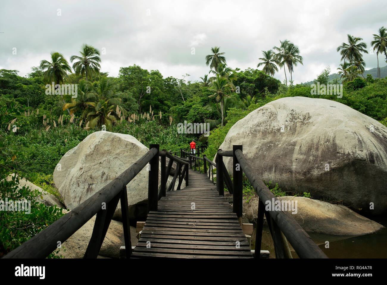 Tourist walkway along giant stones and tropical forest leading to the viewpoint (mirador). Tayrona National Park, Colombia. Sep 2018 Stock Photo