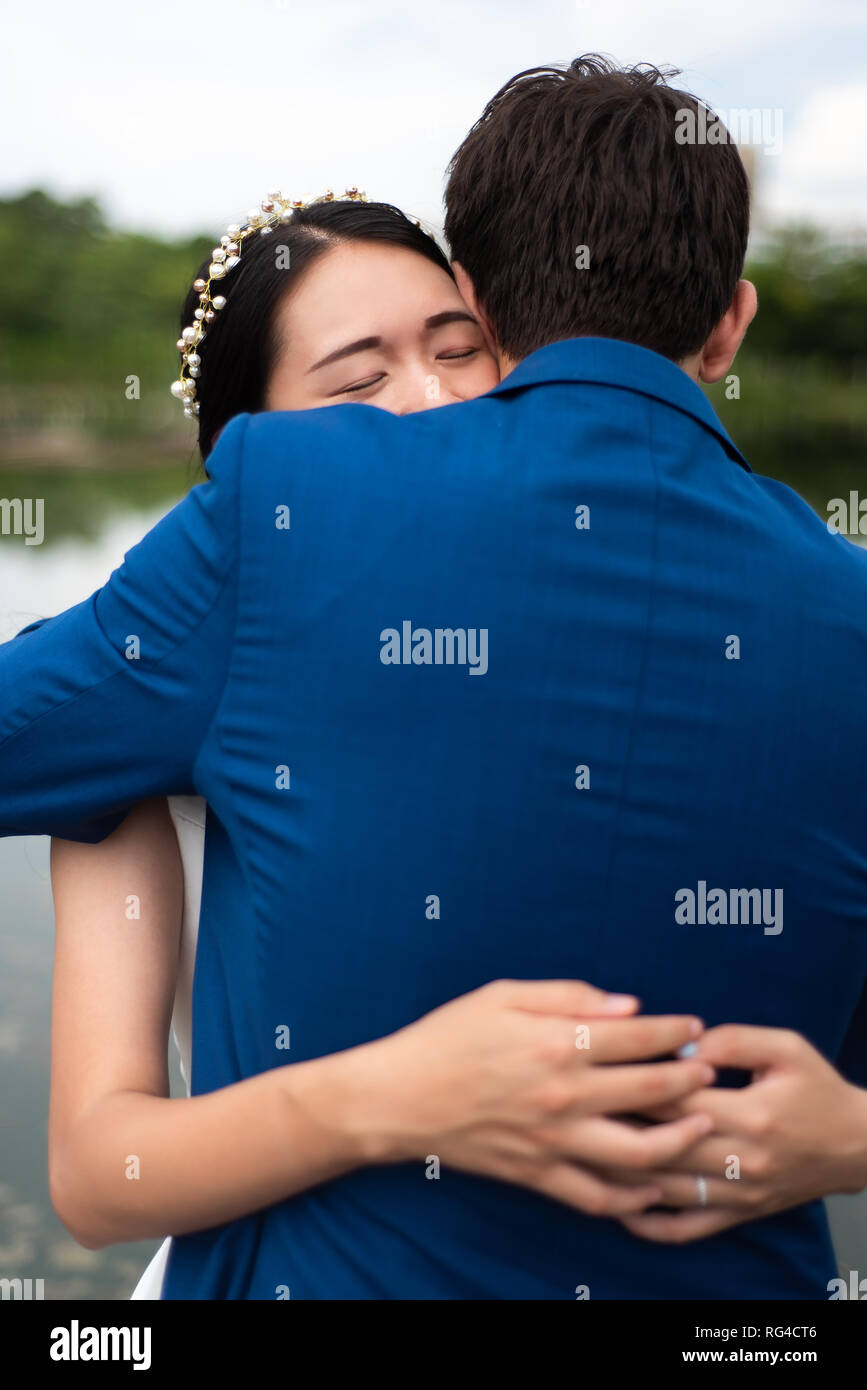 Loving couple hugging in the park close up Stock Photo - Alamy