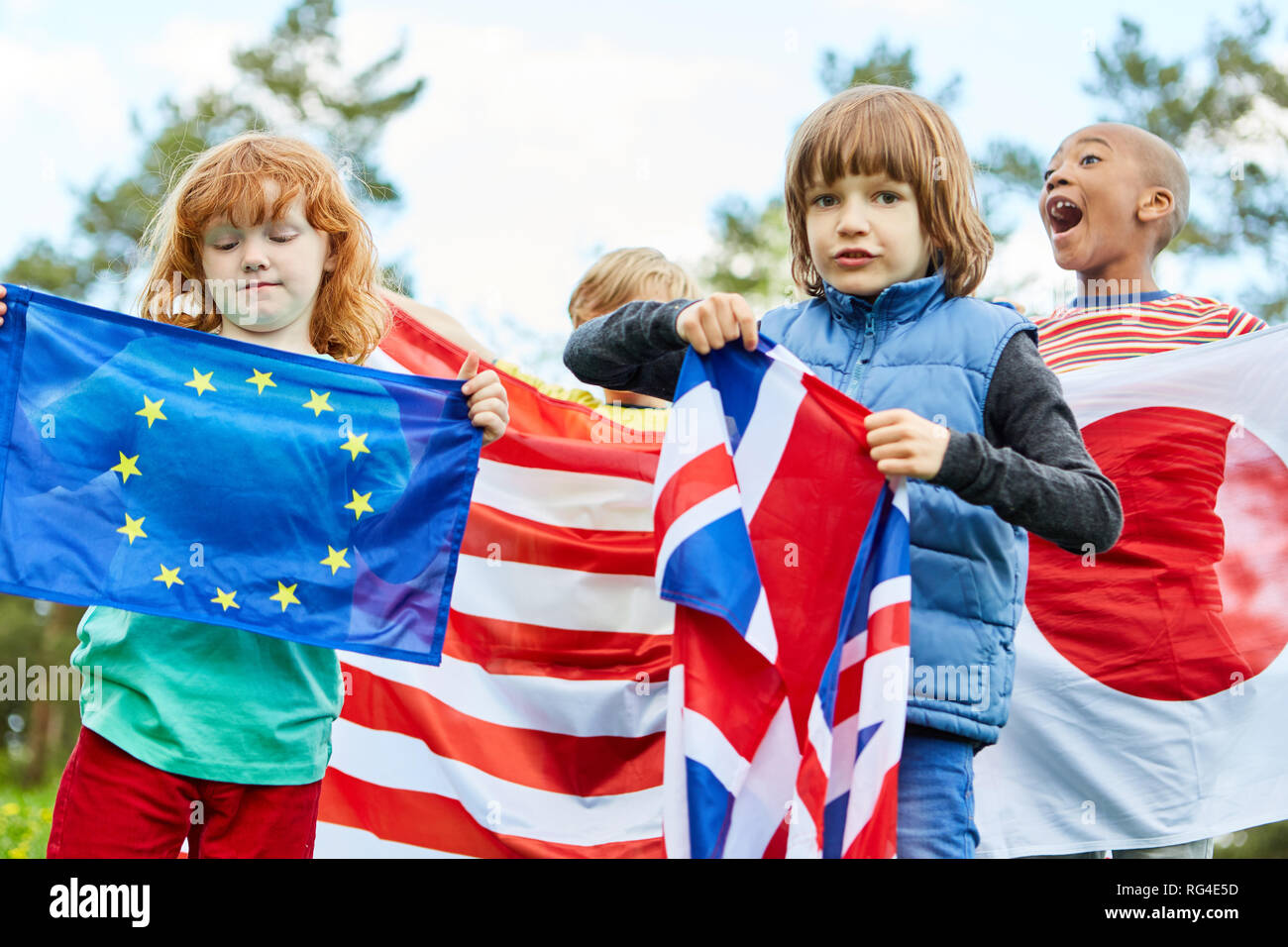 Group of kids in international kindergarten with different flags Stock Photo