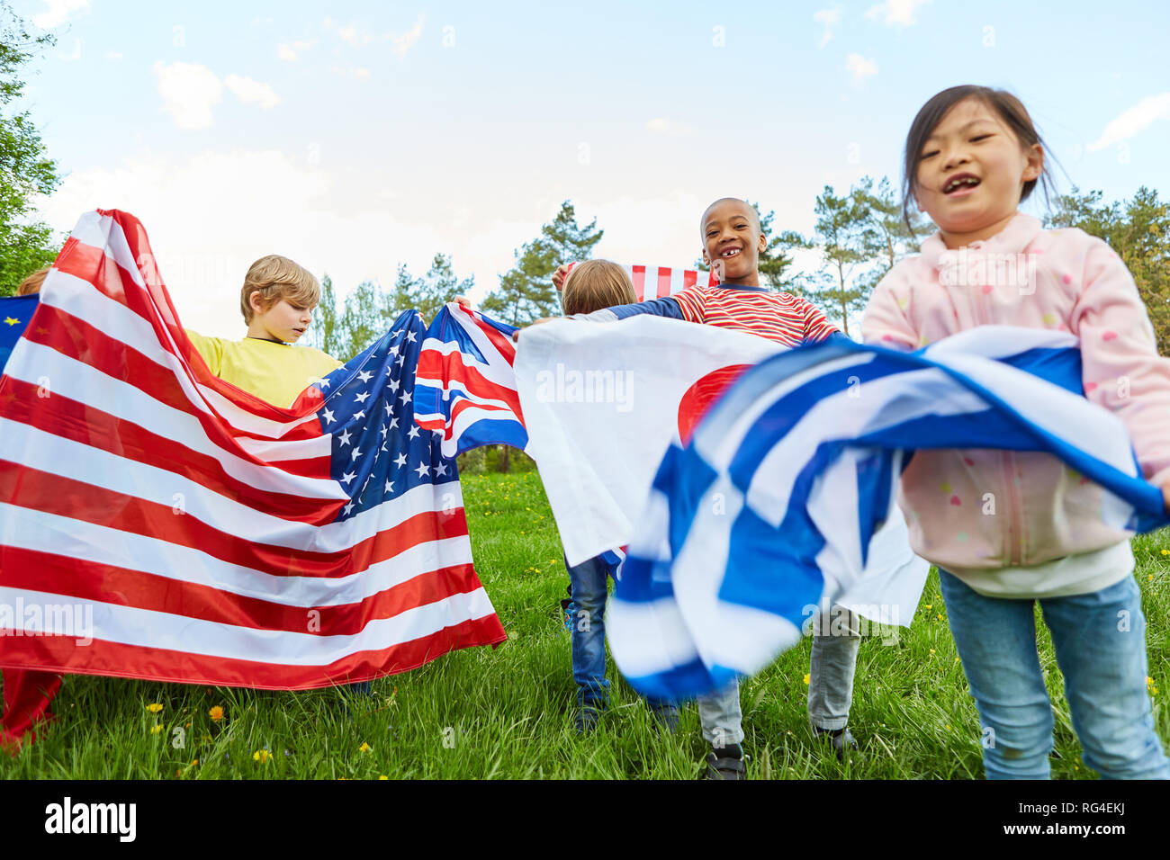 Group of kids with national flags in international kindergarten or youth camp Stock Photo