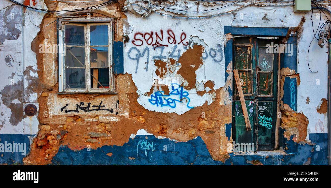 House facade with graffiti, Lagos, Portugal Stock Photo
