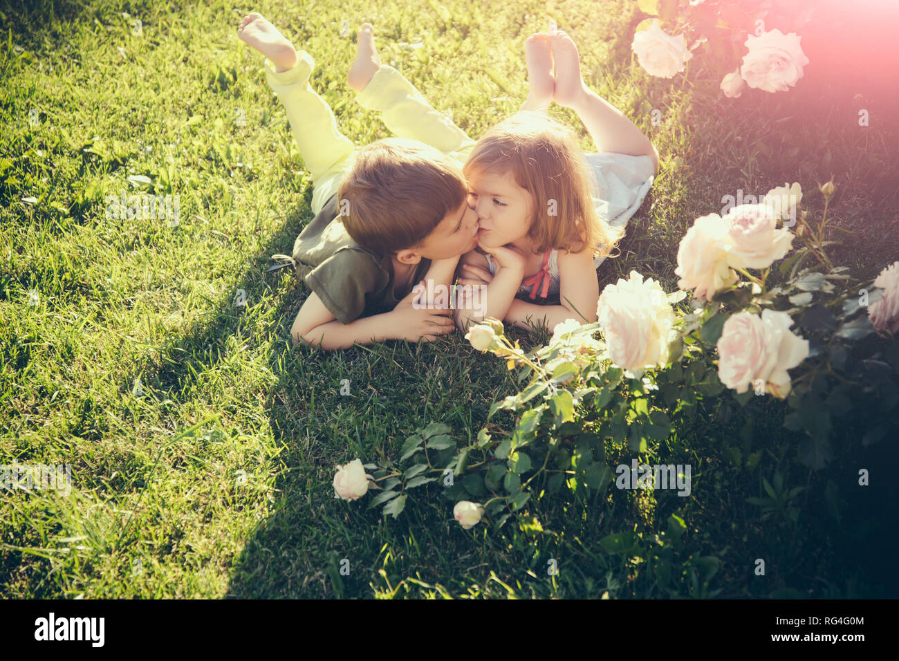 Flower Girl Kissing Boy