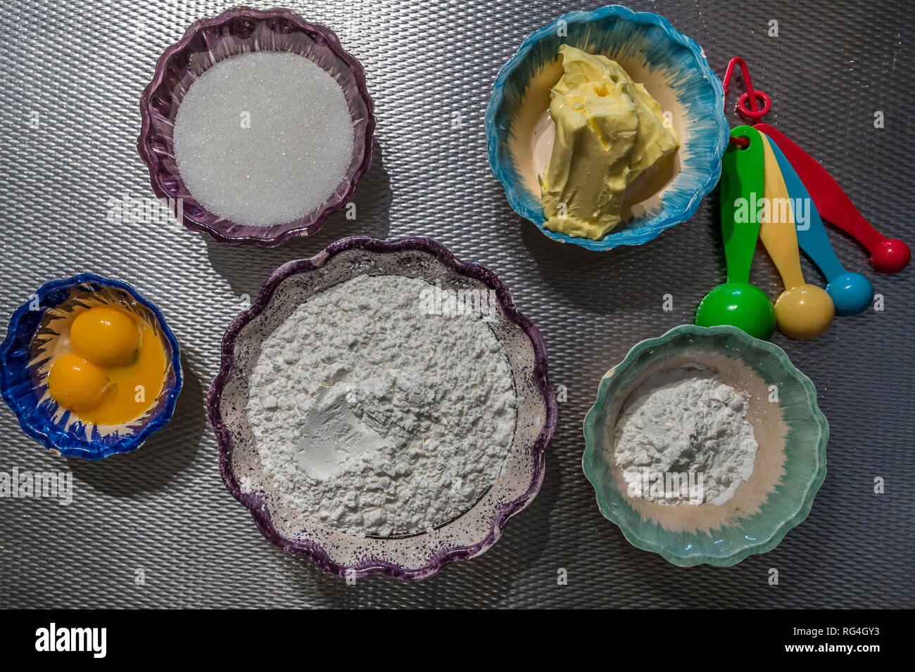image of the ingredients to make cookies, cornstarch, sugar, eggs