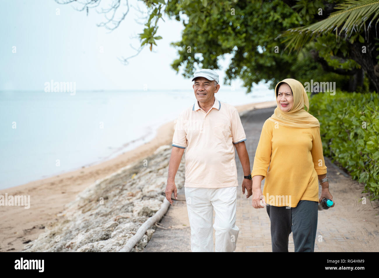 senior asian couple walking and exercising Stock Photo - Alamy