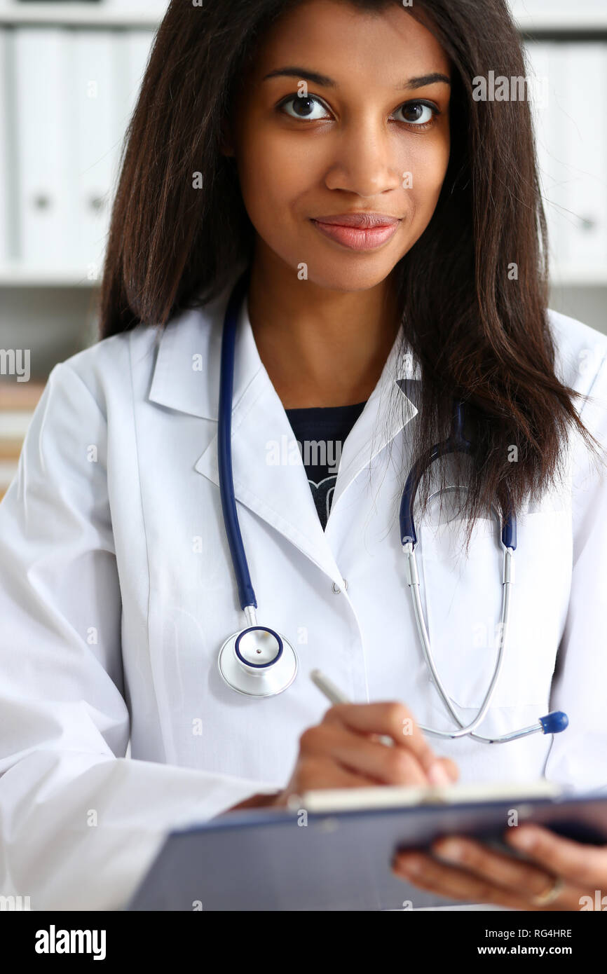 Beautiful smiling female doctor hold Stock Photo - Alamy