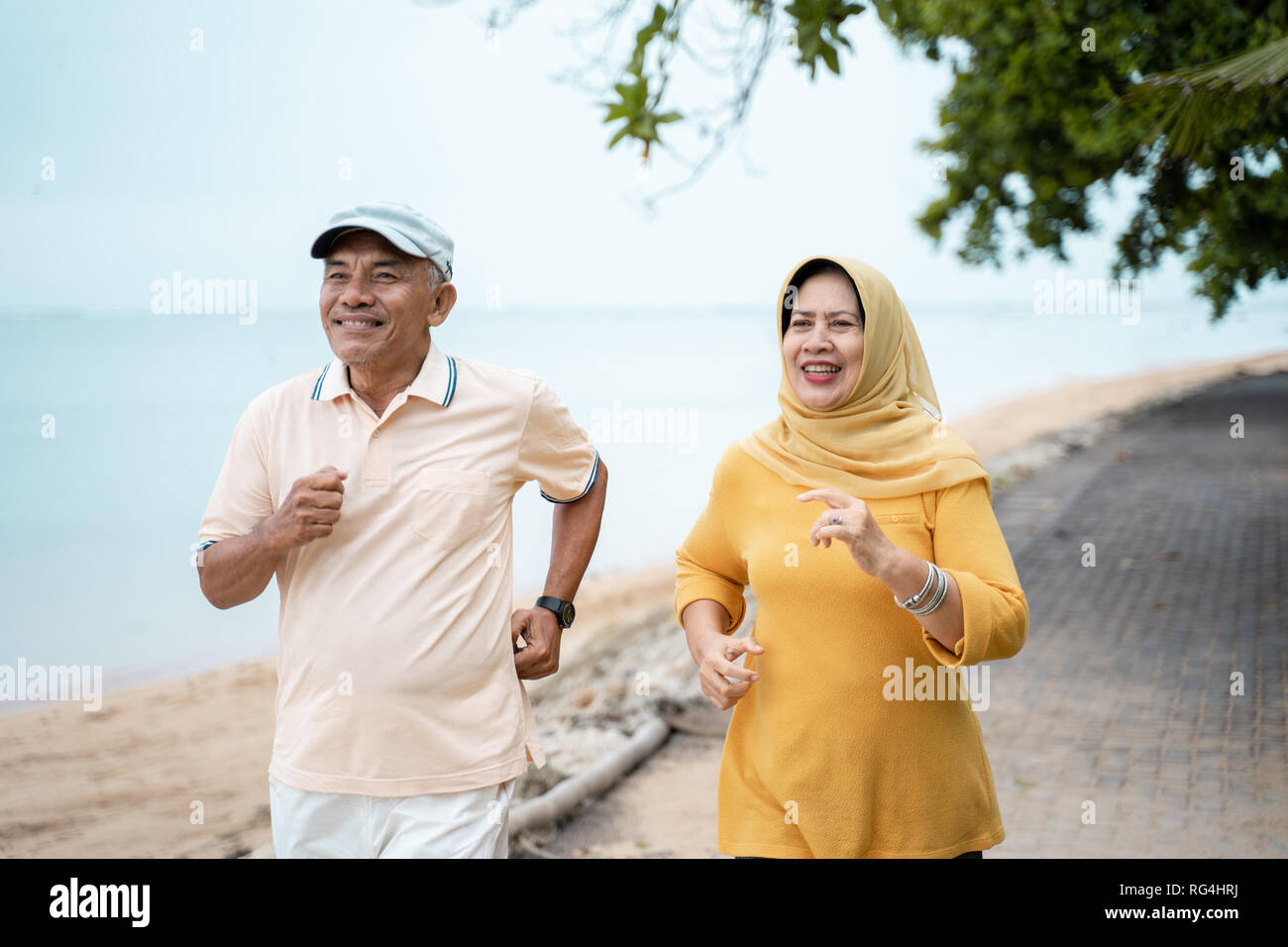 muslim mature couple doing jogging together Stock Photo