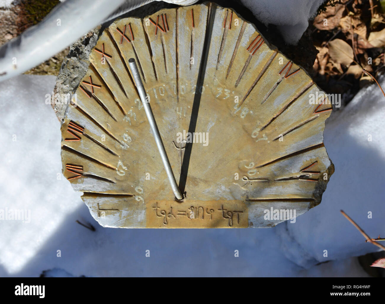 Sundial at the garden. Handmade Sundial. Close up of a garden handmade