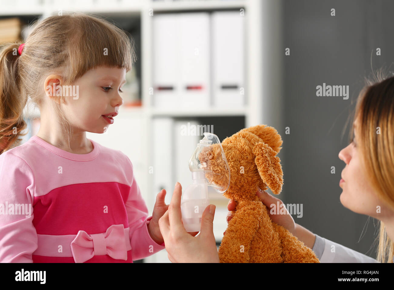 Happy child makes inhalation at home for Stock Photo