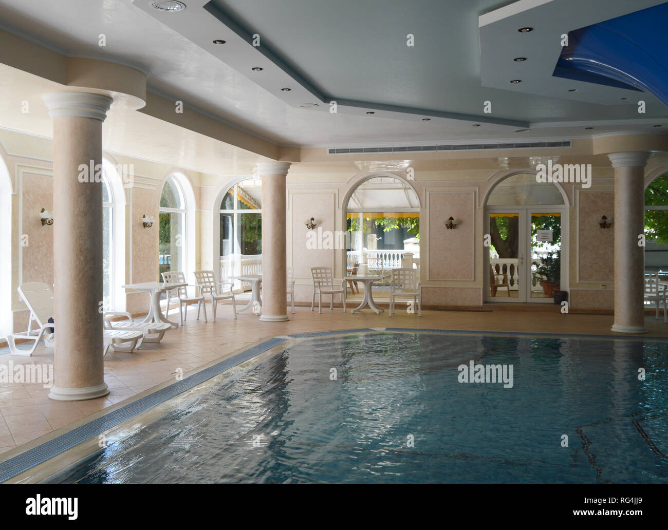 Inside the interior with modern ceiling and pool hi-res stock ...