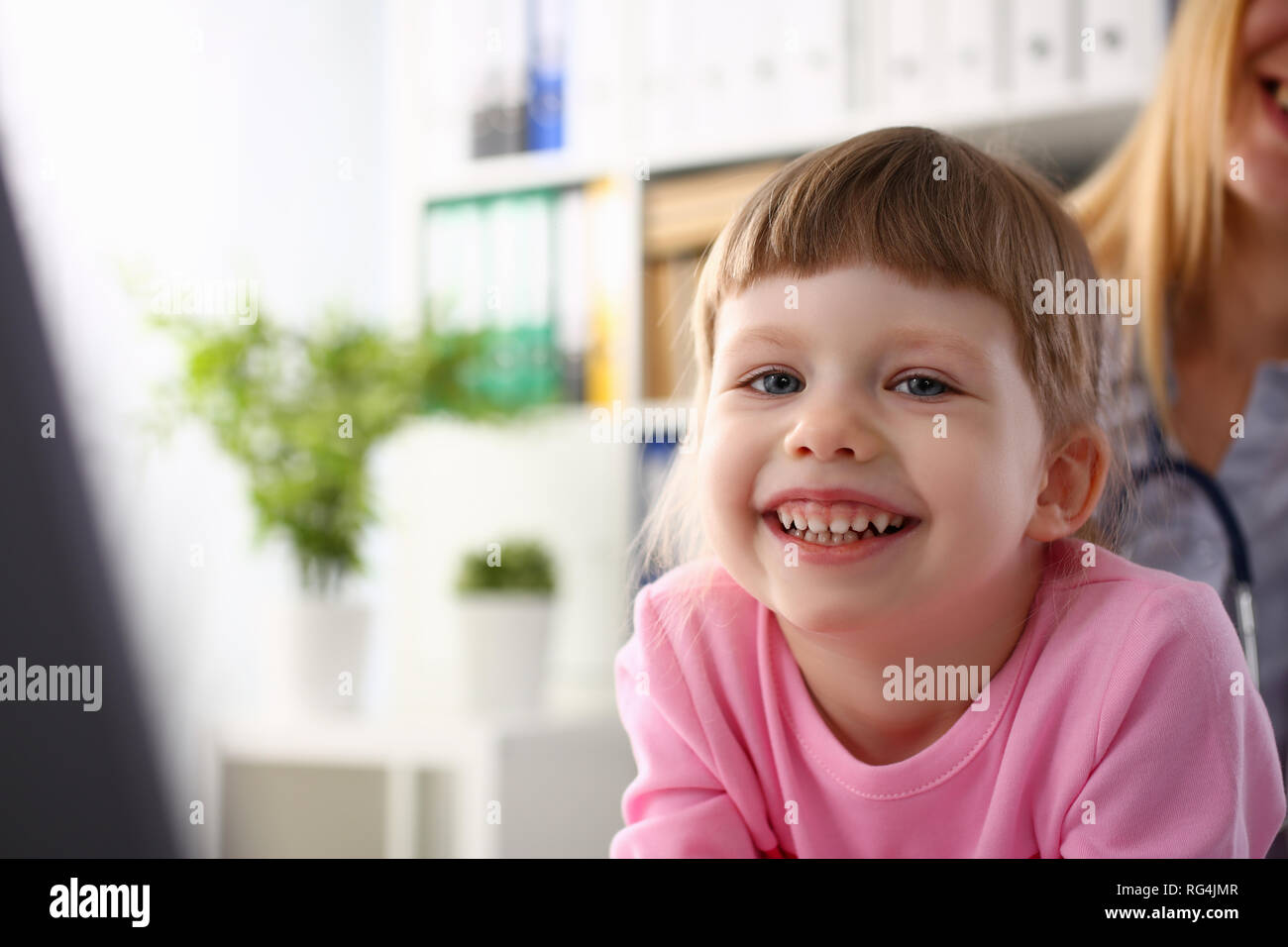 Little child at pediatrician reception Stock Photo Alamy