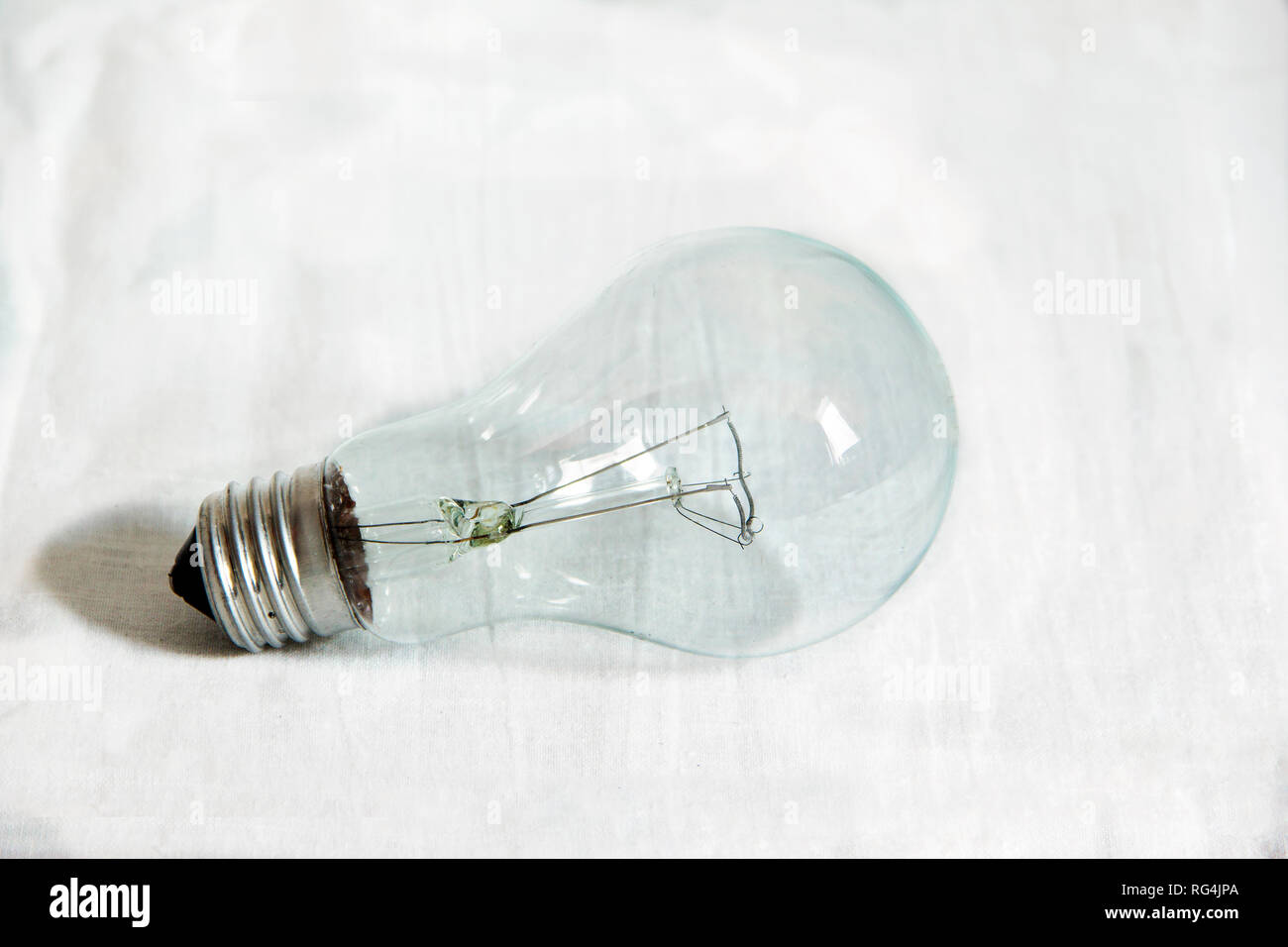 Electric incandescent lighting glass bulb with tungsten spiral isolated