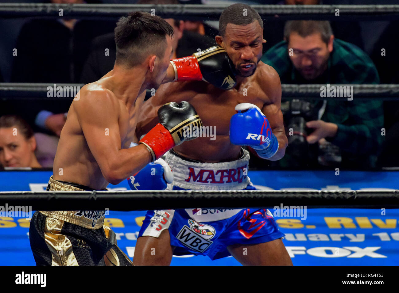 Brooklyn, New York, USA. 26th Jan, 2019. TUGSTSOGT NYAMBAYAR (black and gold trunks) battles CLAUDIO MARRERO in a WBC World Featherweight Eliminator bout at the Barclays Center in Brooklyn, New York. Credit: Joel Plummer/ZUMA Wire/Alamy Live News Stock Photo