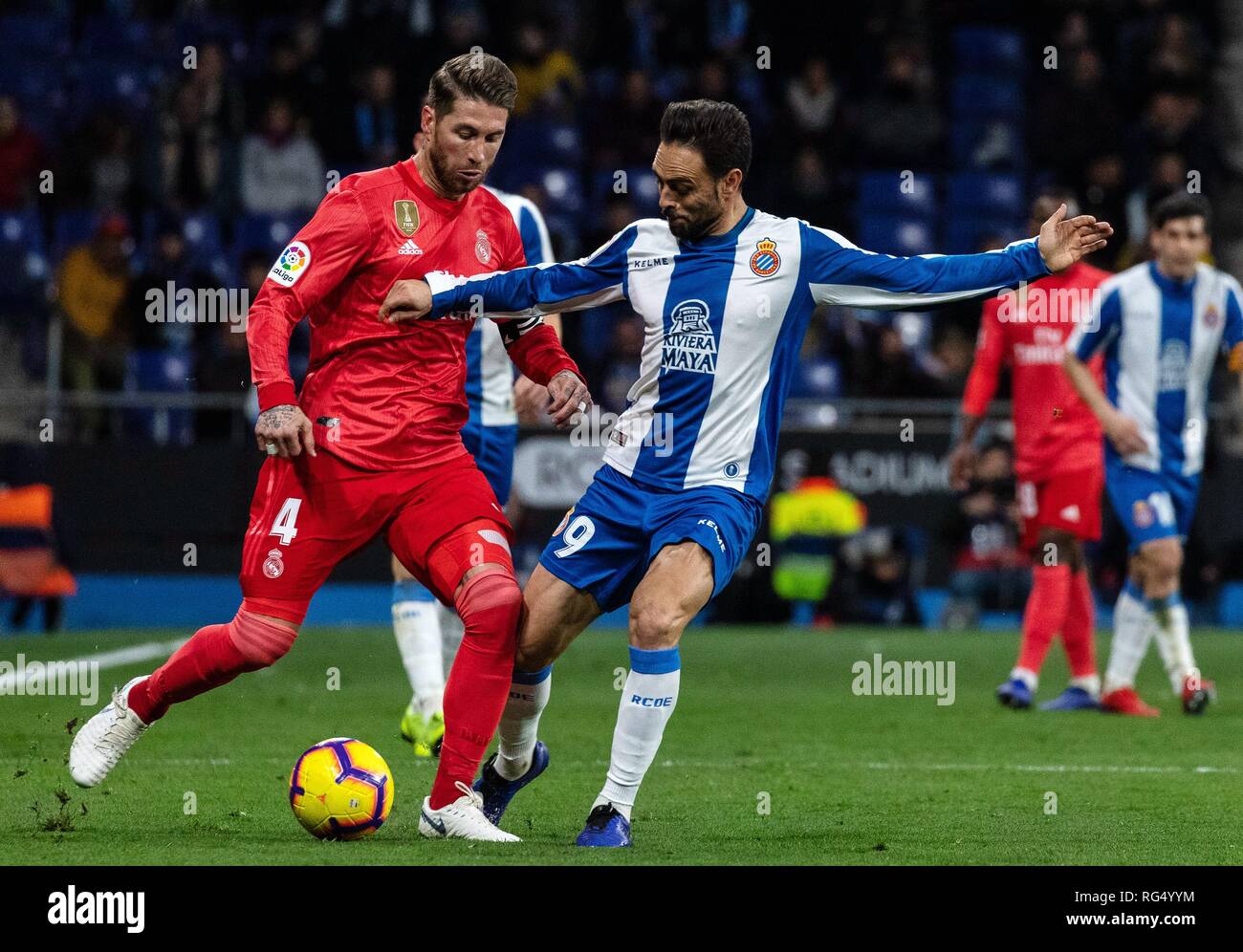 Barcelona, Spain. 27th Jan, 2019. RCD Espanyol's Sergio Garcia (front R)  vies with Real Madrid's Sergio Ramos during a Spanish league match between  RCD Espanyol and Real Madrid in Barcelona, Spain, on