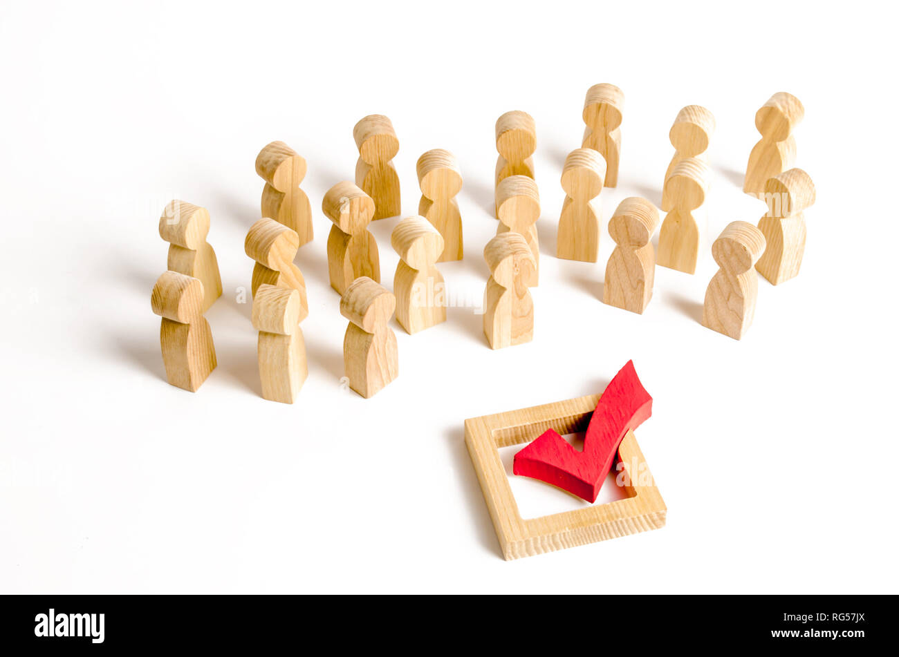 A crowd of people looks at a red check mark. Voting and election concept. Referendum, revolution. Peace and order, legitimization. Forcible overthrow. Stock Photo