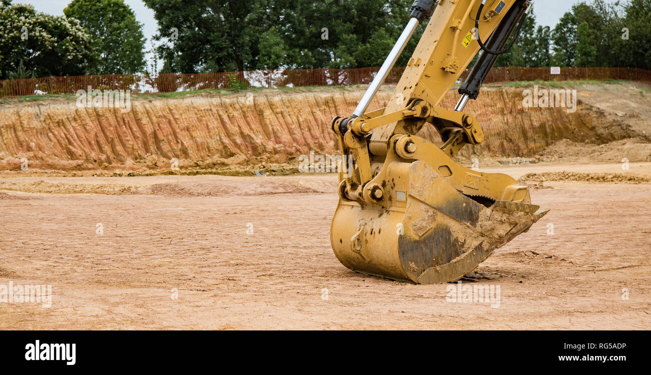 A close up photo of the bucket on an excavator at a construction site. Stock Photo