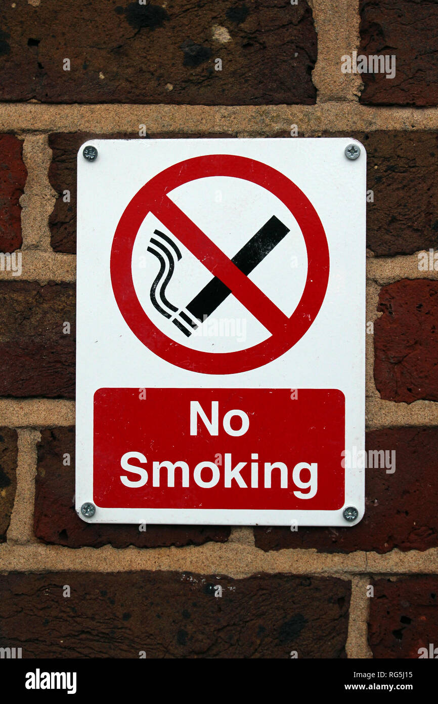 No smoking sign over brick wall in Brighton & Hove City Council, England, UK Stock Photo