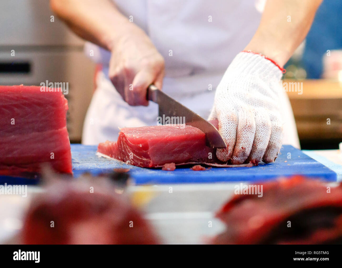 Chef cutting fresh tuna fish in the kitchen Stock Photo Alamy