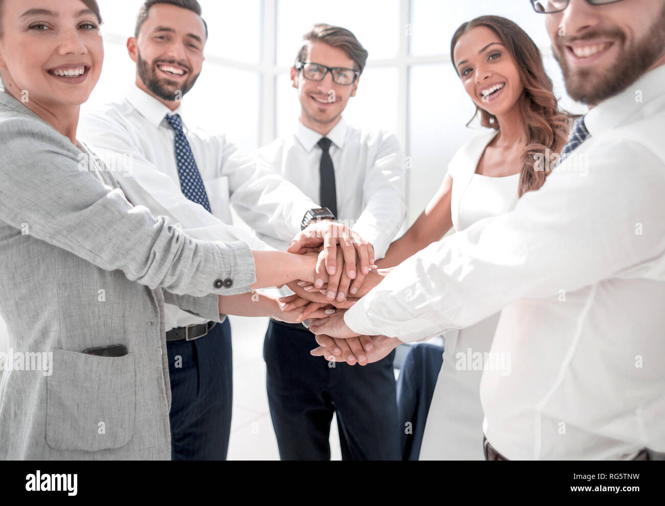 business team showing their unity Stock Photo - Alamy