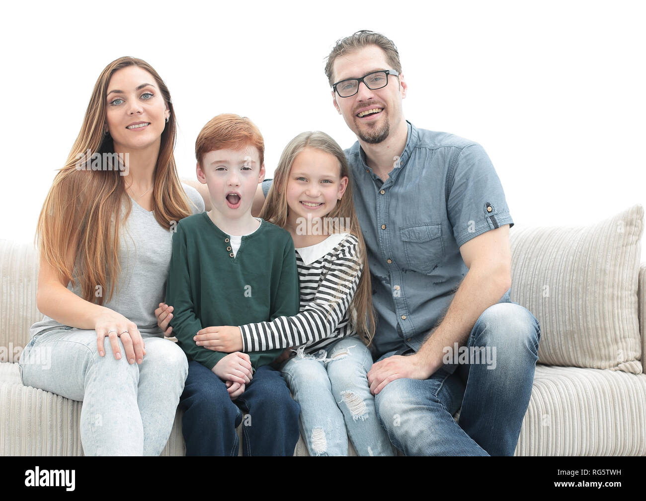 happy family sitting on the couch in the living room Stock Photo - Alamy