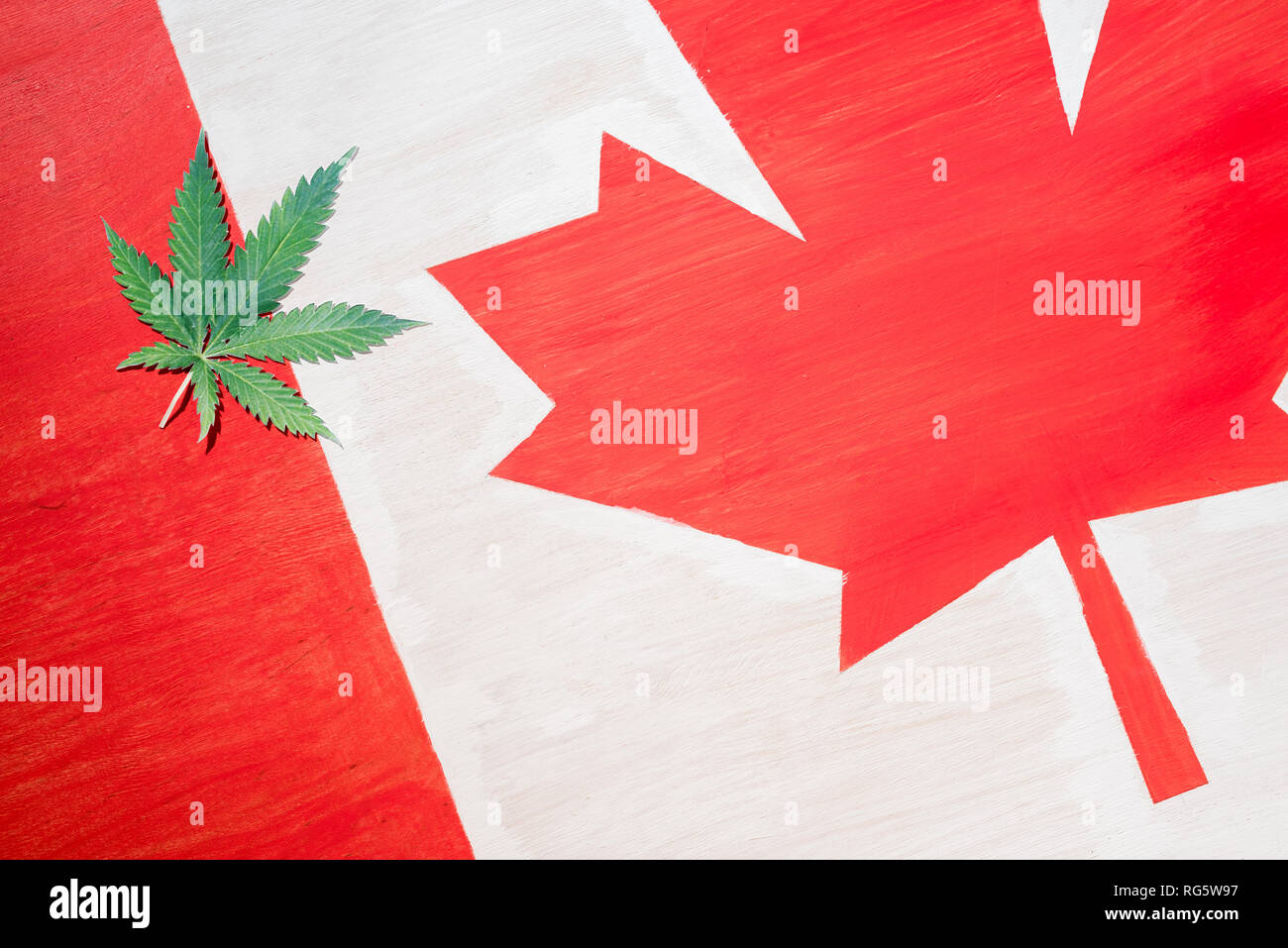 cannabis leaf on canadian flag with copy space, marijuana legalization concept Stock Photo