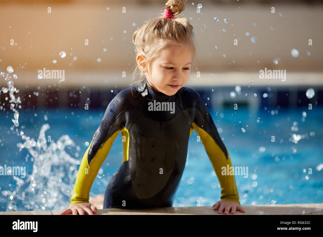 Funny girl playing in swimming pool Stock Photo Alamy