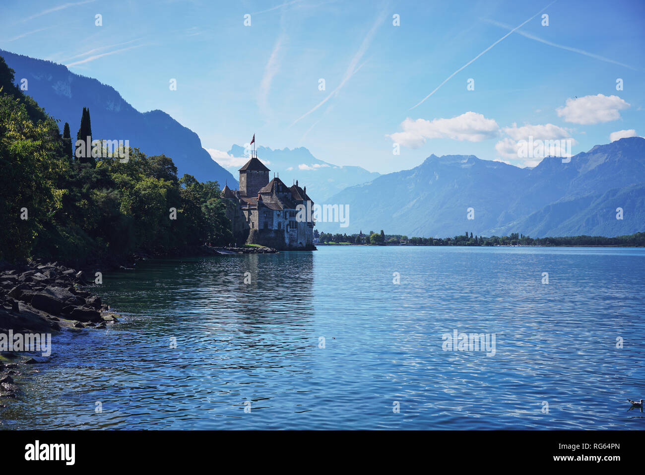 Chateau de Chillon Castle and mountains. It is a medieval fortress on Lake Geneva (Lac Leman), near Montreux, canton of Vaud, Switzerland Stock Photo