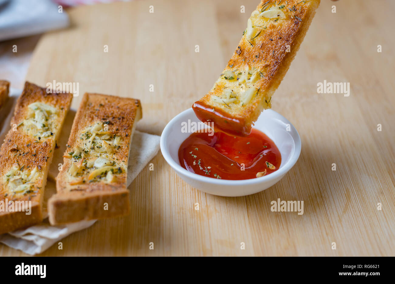 Garlic bread with ketchup Stock Photo - Alamy