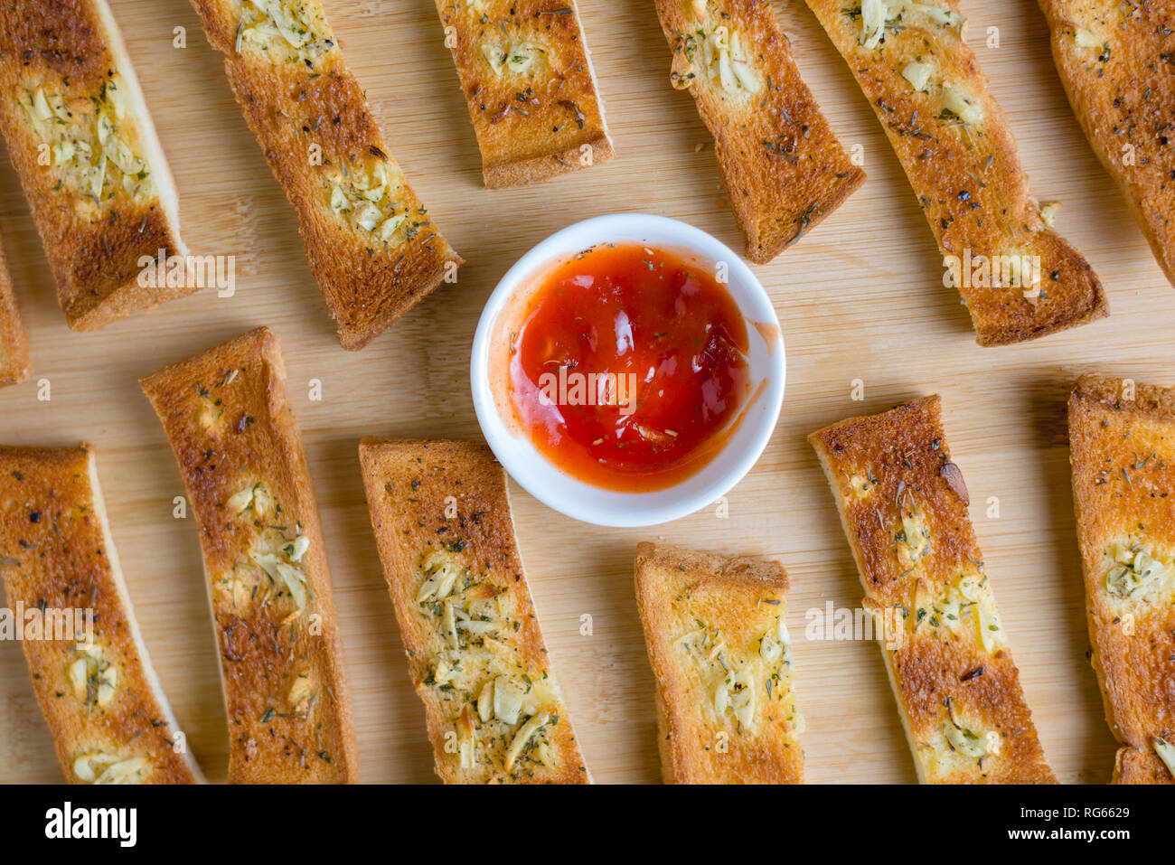 Garlic bread with ketchup Stock Photo Alamy