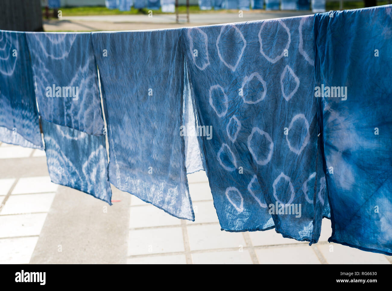 Drying indigo clothes Stock Photo