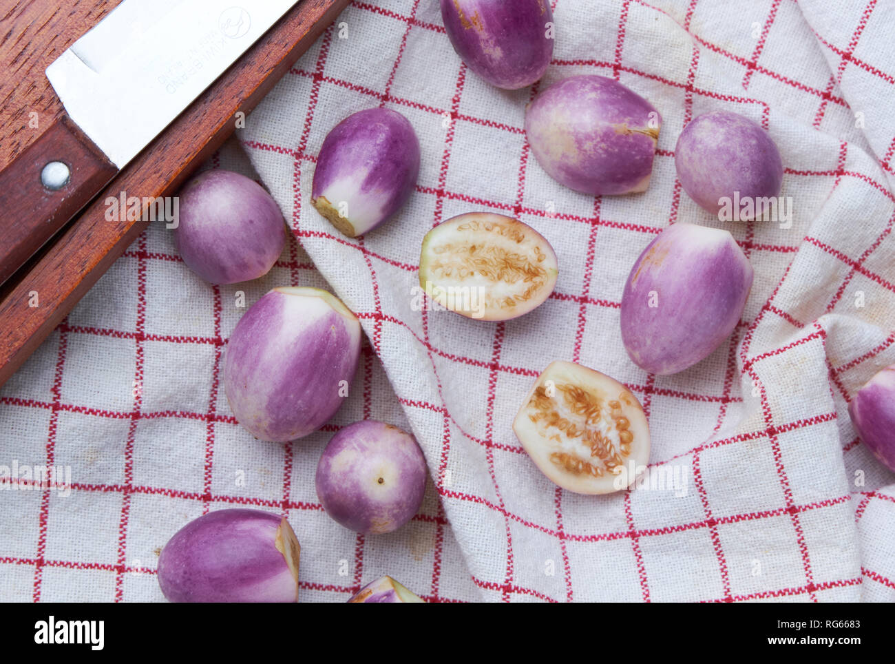 Preparing purple eggplant for cook Stock Photo Alamy