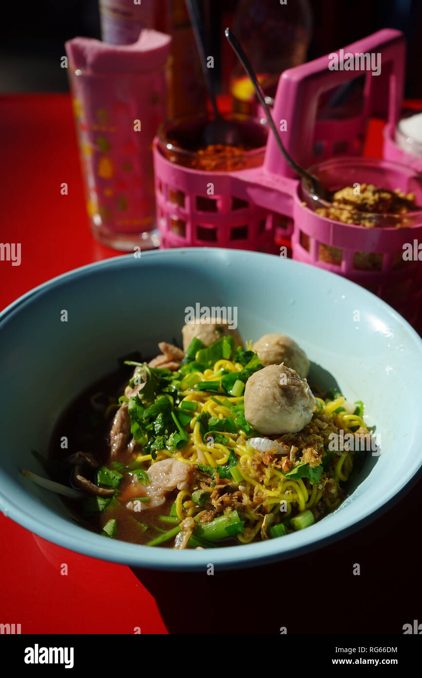 Egg noodle and spicy soup in Thai street market Stock Photo Alamy