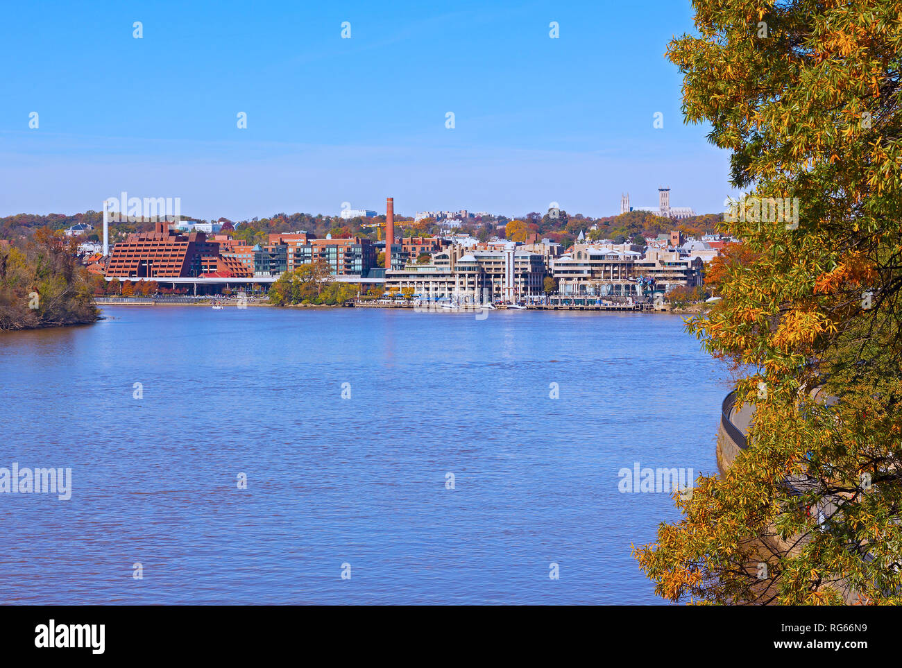 Georgetown waterfront along Potomac River in autumn, Washington DC, US. Panoramic view on US capital and cityscape with National Cathedral on horizon. Stock Photo
