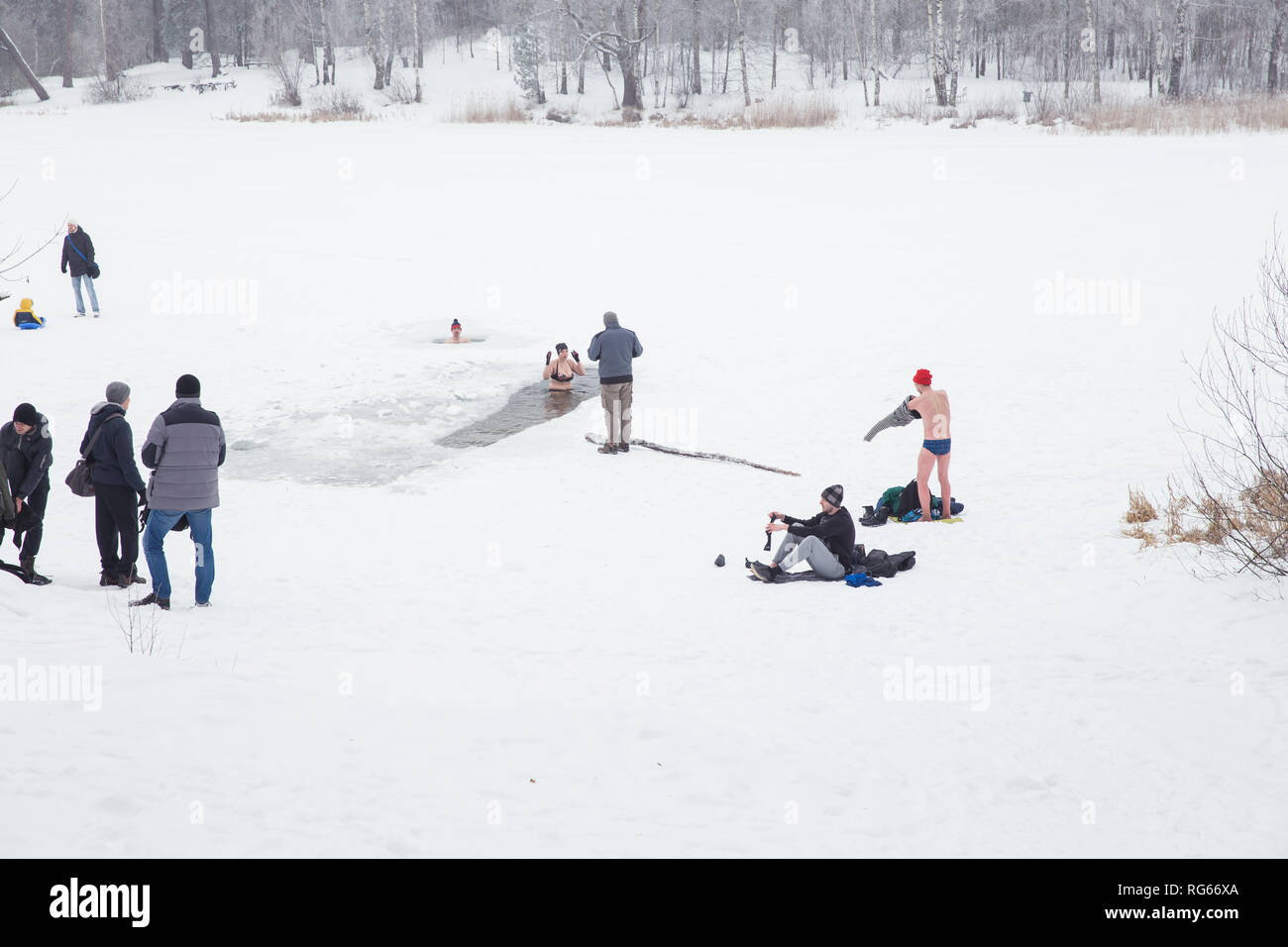 City Riga, Latvia. Peoples swimmning in winter. Cold water, snow an peoples. Travel photo 2019, 27. january. Stock Photo