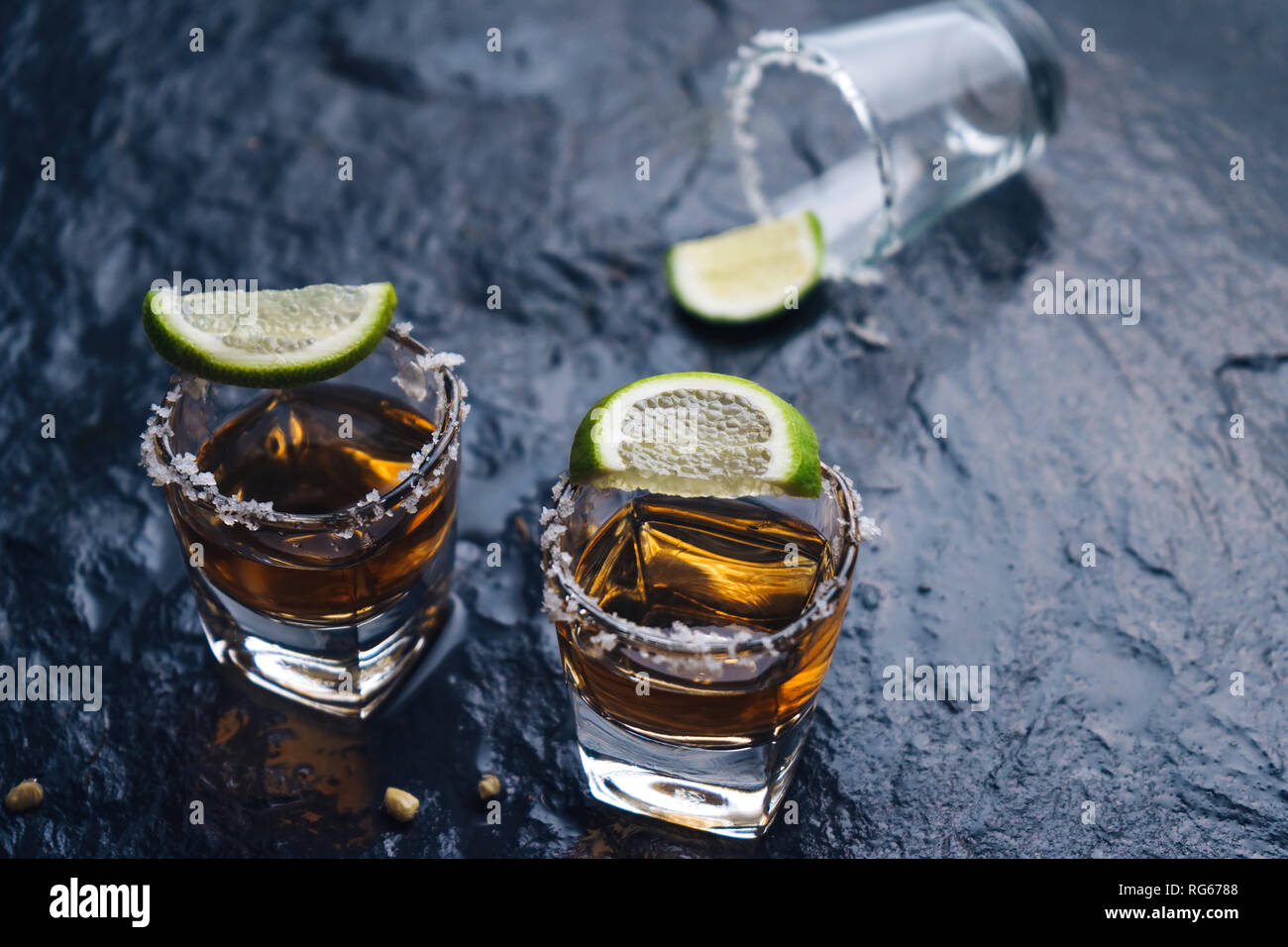 Shoot glass of liqour with salt and lime Stock Photo