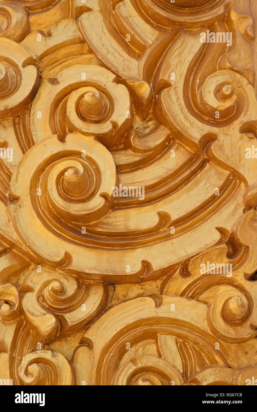 Close-up view of the delicate golden pattern in the Thai Buddhist ...