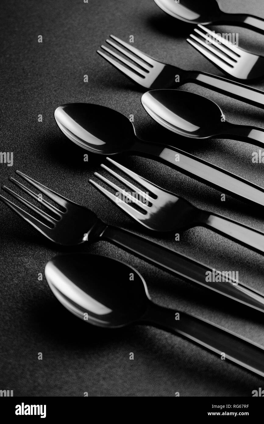 Black plastic cutlery Stock Photo