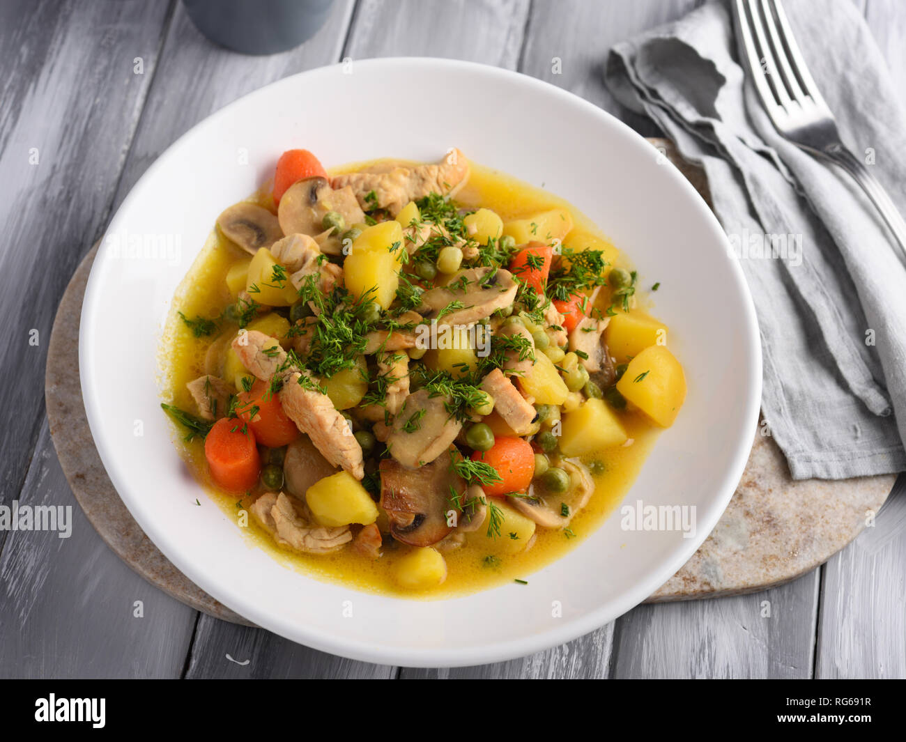 Chicken and Mushroom Fricassee with potato, carrot, green peas, and