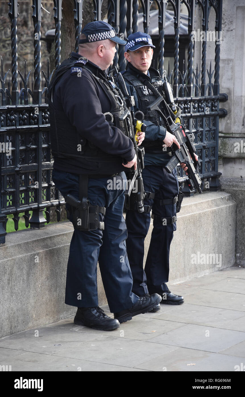 Armed Police Officers guarding The Houses of Parliament,Westminster,London.UK Stock Photo