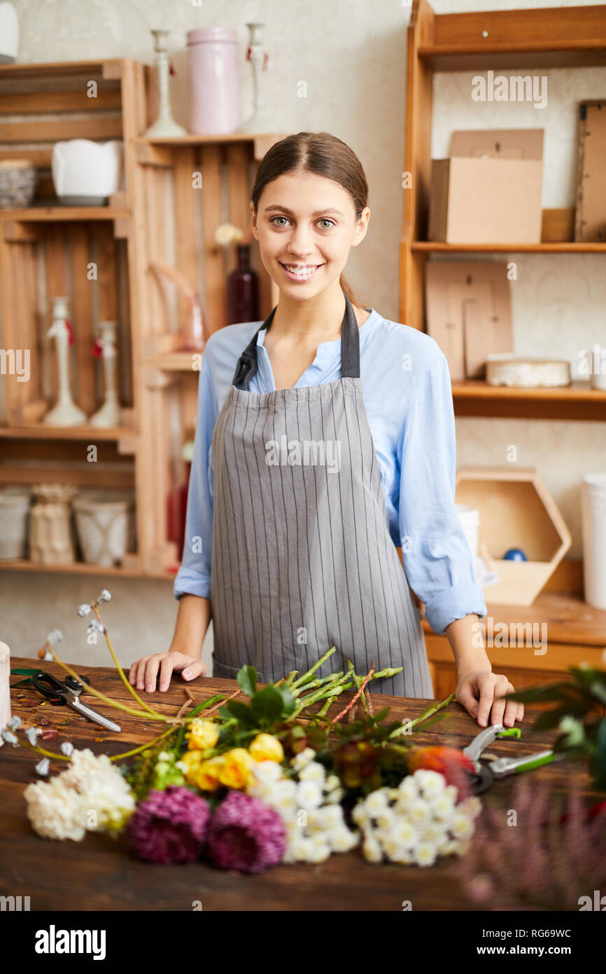 Smiling Florist in Flower Shop Stock Photo