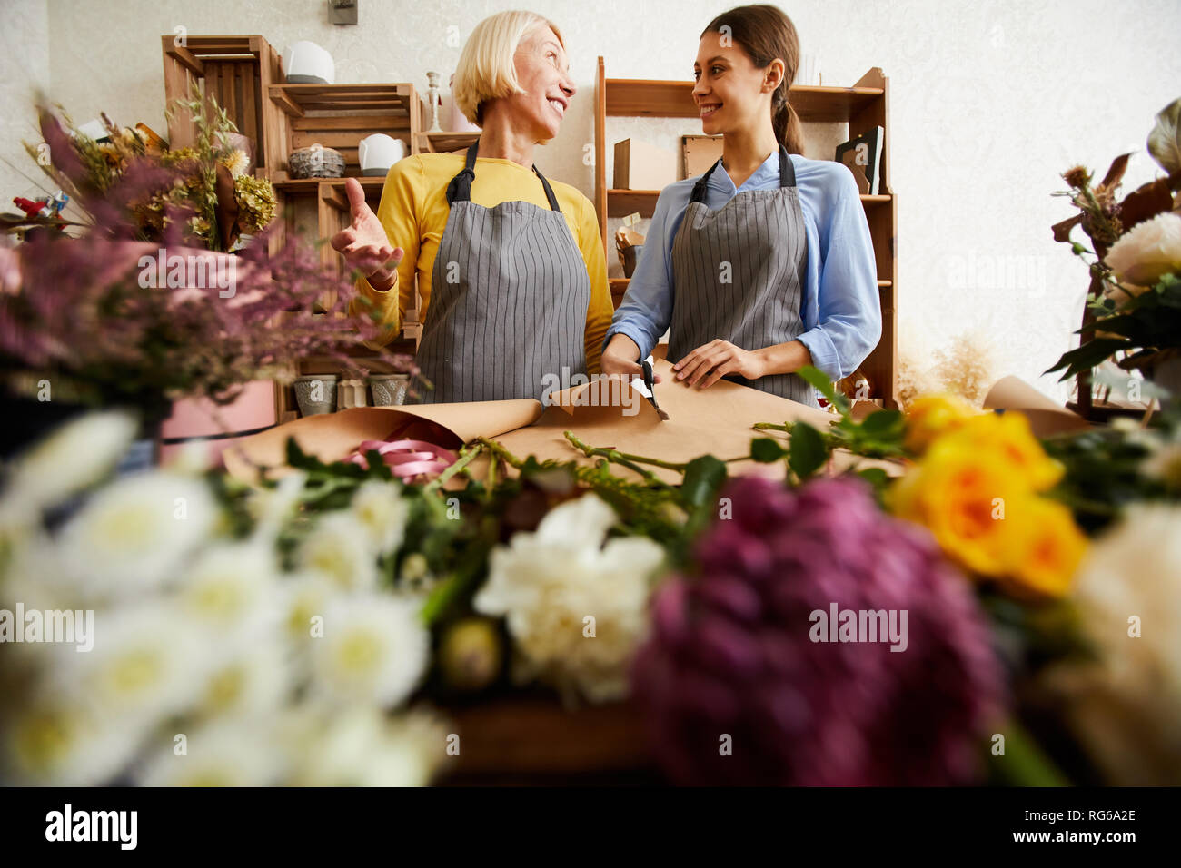 Two Women Working in Flower Shop Stock Photo
