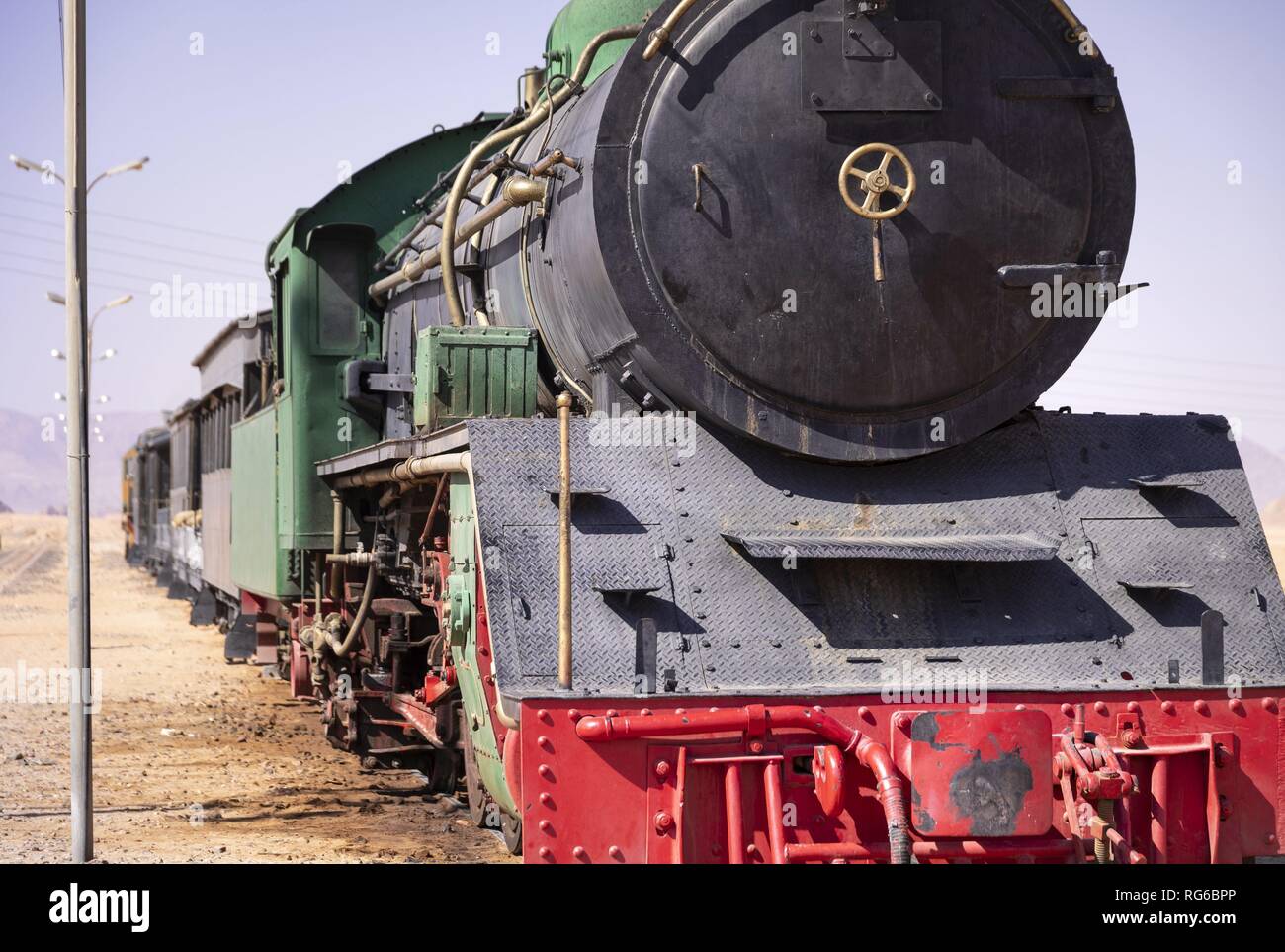 This historic train at Wadi Rum station in Jordan is used today only for tourist purposes. But on the tracks at the edge of the desert also trains with phosphate roll to the port of Aqaba. (07 November 2018) | usage worldwide Stock Photo