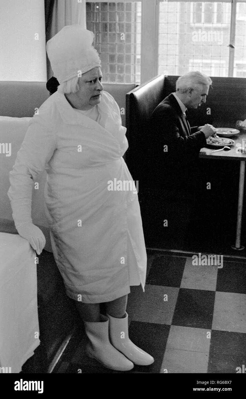Phobia fear of germs. Obsessive fear anxiety. This woman person dressed only all in white, she needs to feel clean and had a fear of germs. Strangely she  was often to be found in Whiteleys department store in Bayswater, West London  during the early 1970s. Seen here in the cafe at the top of the store in 1971. UK HOMER SYKES Stock Photo