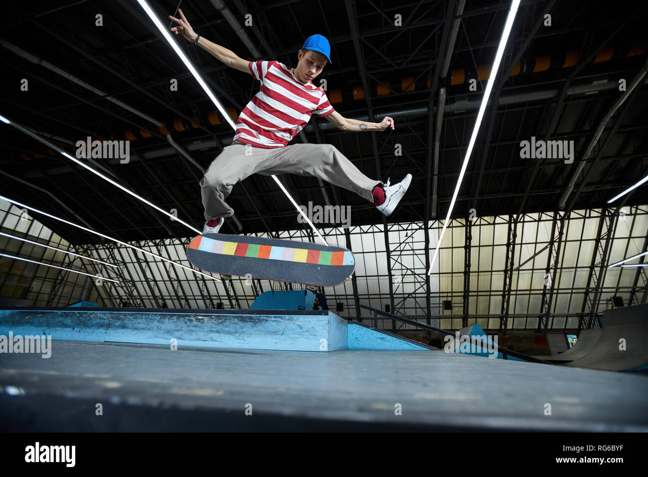 Jumping over skateboard Stock Photo