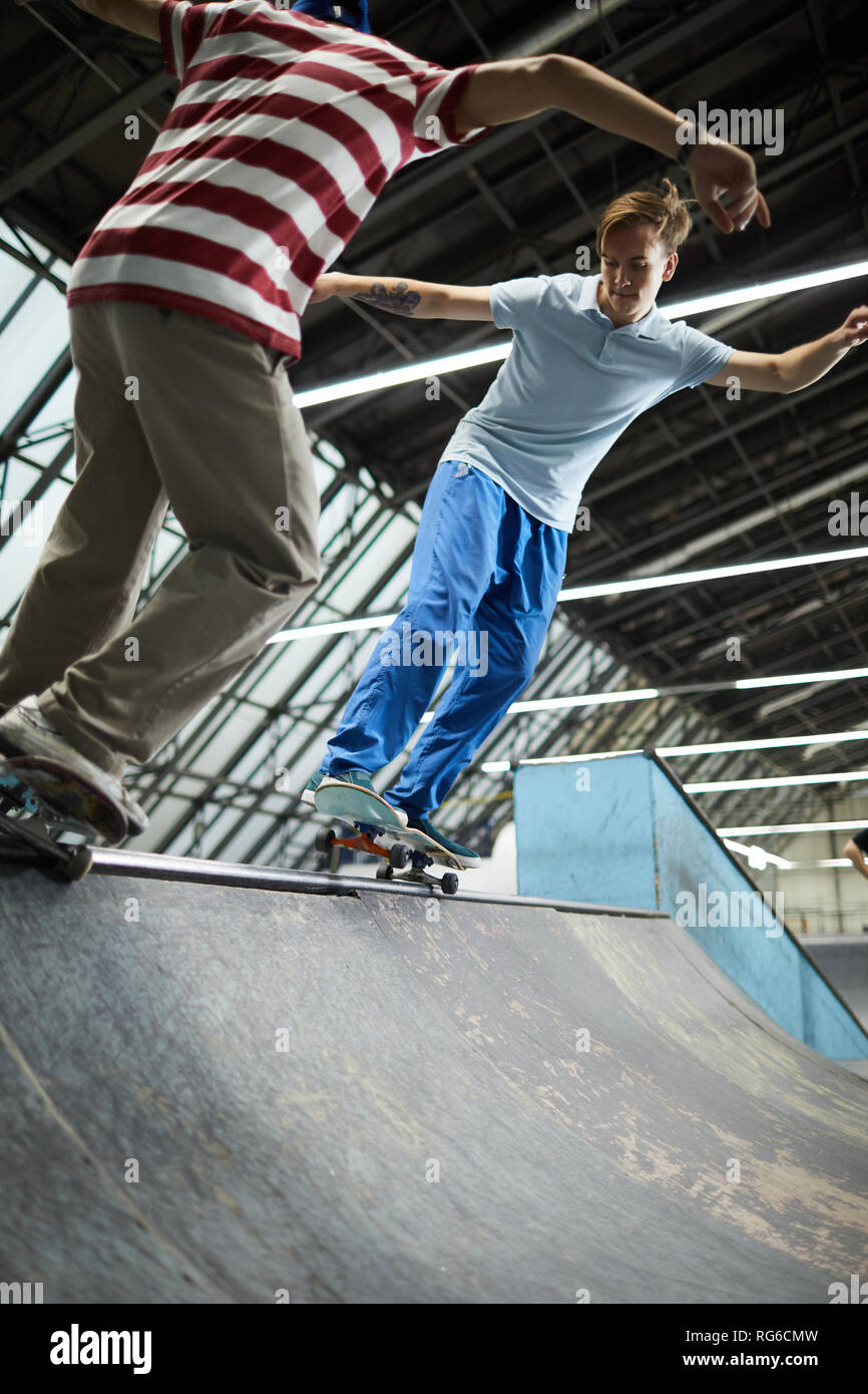 Skateboarding at parkour center Stock Photo